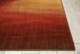 Close up of the Ruby Nourison Radiant Arts rug showing the texture and gradient of ruby red to gold.