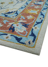 Ollie Traditional Blue And Ivory Hand Tufted Wool Rug