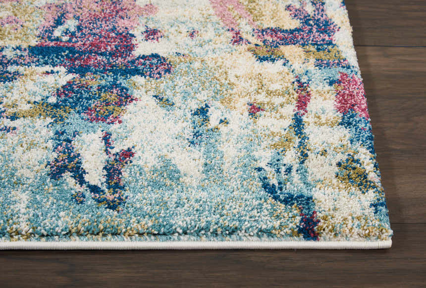Close-up of Nourison Fusion Cream Multicolor rug showing abstract pattern, blue, pink, cream, and gold tones, and soft texture.