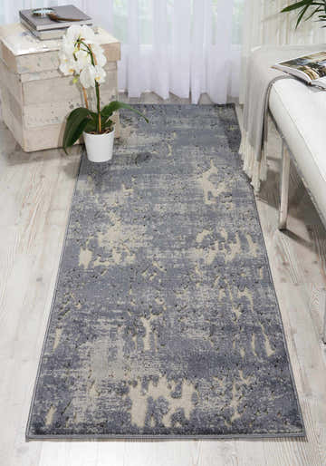 Light-filled room with a Michael Amini Gleam Slate rug, white bench, and orchid. Modern, taupe runner rug.
