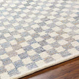 Close-up of the Halen Gray Checkered Area Rug showing its geometric, textured, charcoal and light gray checkered pattern. Texture