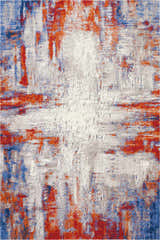 Close-up of Nourison Twilight Ivory Multicolor rug. Abstract design with chestnut, ivory, and blue hues.