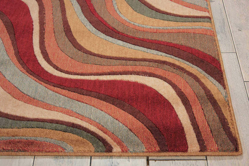 Close-up of Nourison Somerset Multicolor rug showing wavy stripes of red, tan, brown, orange, and gray.