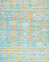 Close-up of Nourison Madera Sky Blue Tribal Indoor Area Rug featuring diamond and geometric patterns.