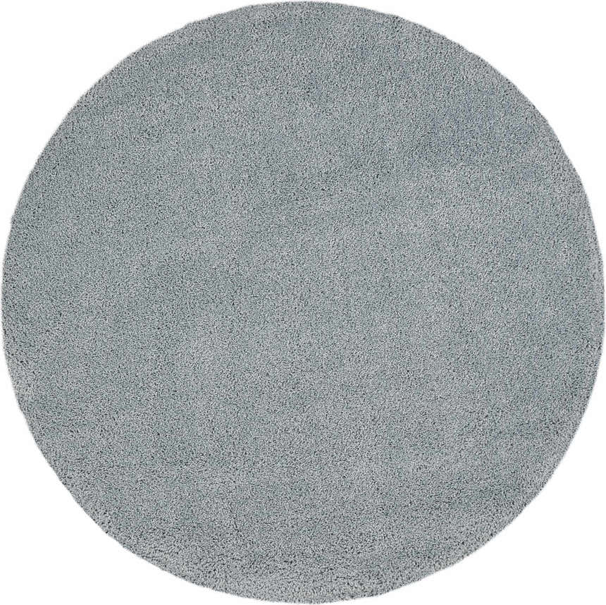 Close-up of a round, slate-colored Nourison Malibu Shag rug. Plush, textured pile.