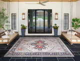 Covered patio with swing benches and the Halayhayin Premium Rug in brick red, brown, and cream. Farmhouse style. Roomscene-Rectangle