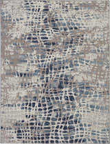 Close-up of Nourison Urban Decor Ivory/Grey Area Rug. Modern design with chestnut accents and abstract pattern.