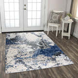 Entryway scene with Rizzy PLC855 abstract area rug in beige, black, blue and ivory. White french doors and chair. Roomscene-Rectangle