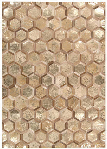Close-up of the Michael Amini City Chic Amber Gold rug. Features a modern geometric hexagon pattern in gold and brown tones.