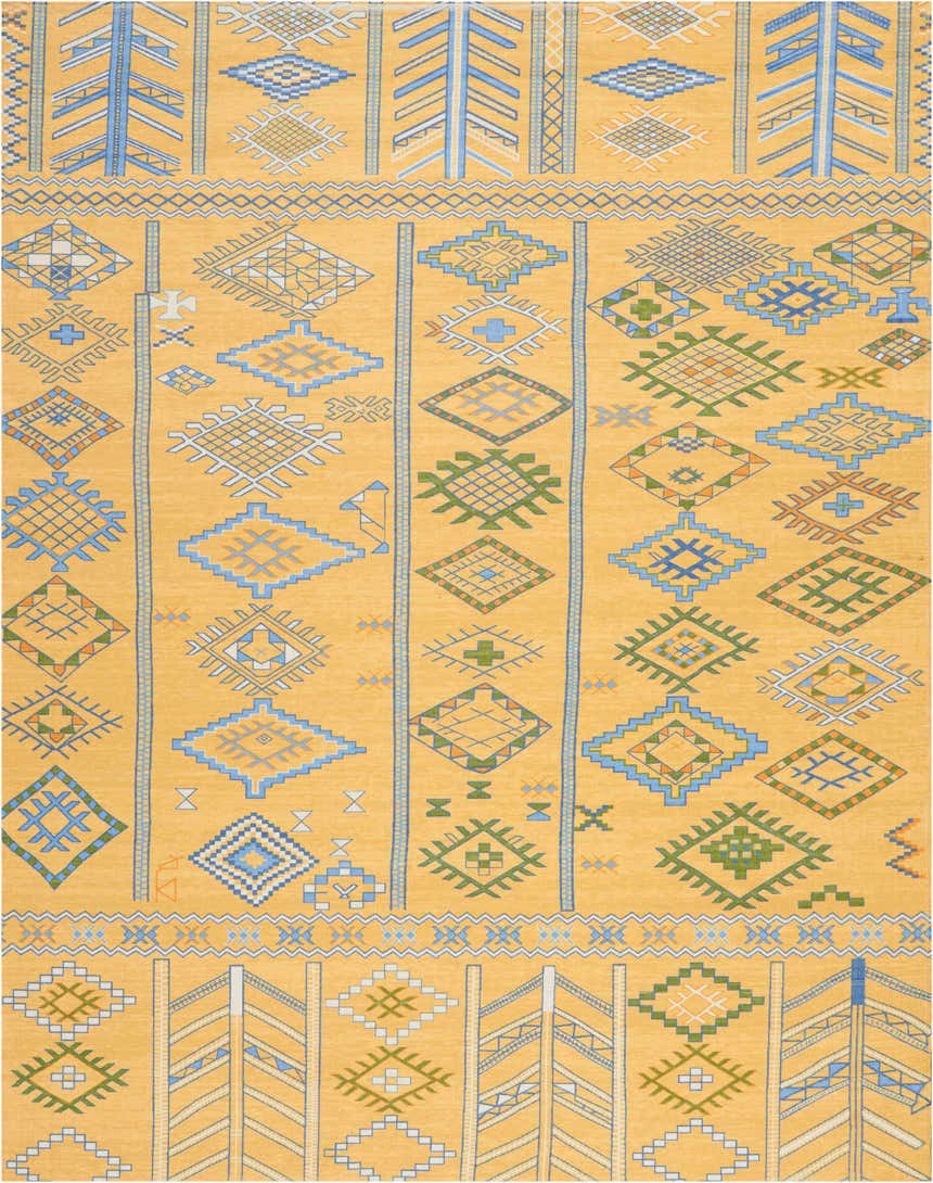 Close-up of Nourison Madera Saffron Tribal rug. Mustard yellow with blue, green, and white geometric tribal patterns.