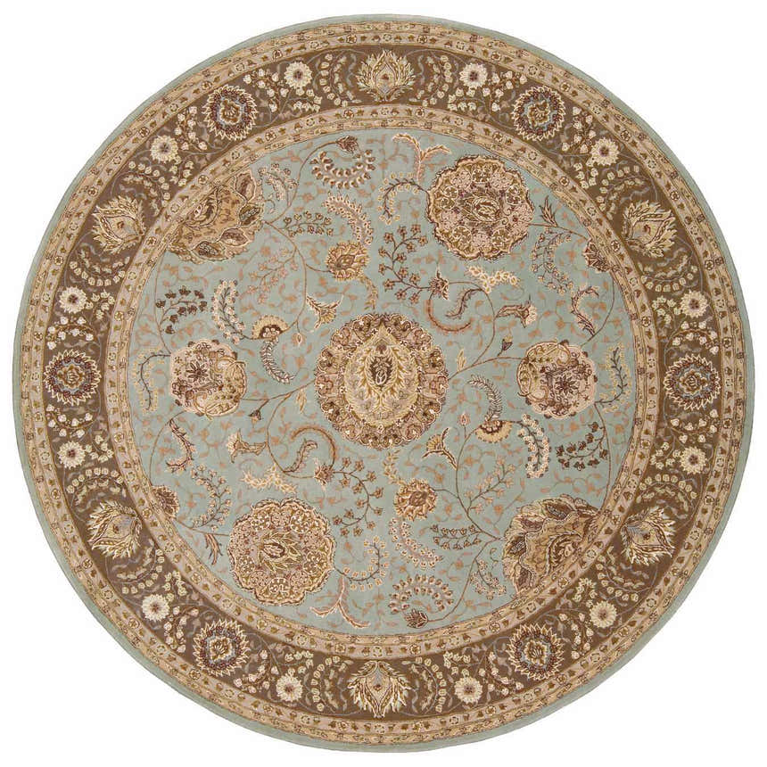 Close-up of round Nourison 2000 Blue Persian rug. Light blue field with brown floral pattern and border. Handmade wool rug.