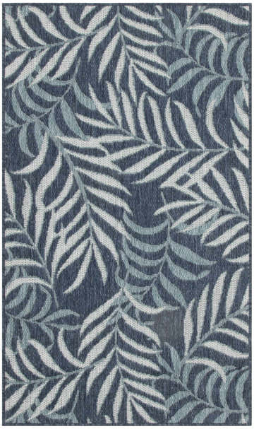 Close-up of the Nourison Garden Oasis Navy Tropical Area Rug, featuring a woven leaf pattern in shades of navy and white.
