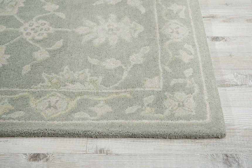 Close-up of the Nourison Zephyr Light Taupe rug showing floral pattern and wool texture on a light wood floor.