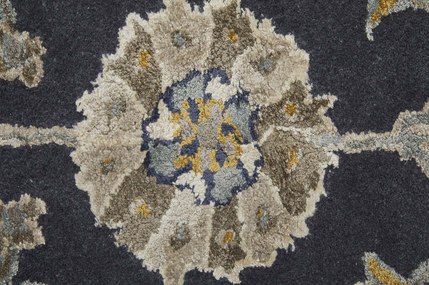 Close up of the Feizy Prescott rug. Floral design with blue, silver, gray, and gold tones. Hand-tufted wool and viscose. Texture