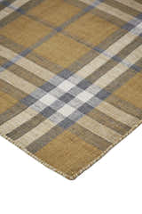 Close up of Feizy Crosby Transitional Plaid rug. Gold, blue, and white create a farmhouse plaid pattern. Hand woven texture. Corner
