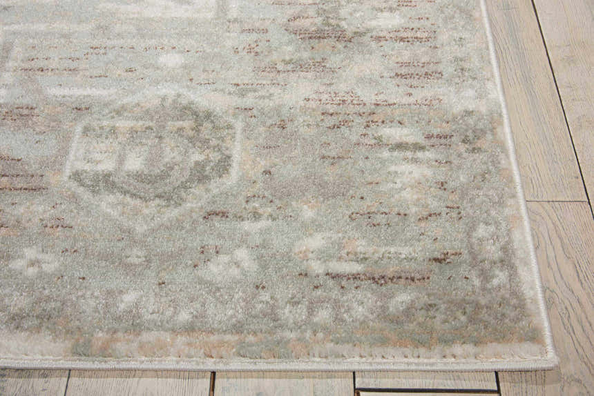 Close-up of the Nourison Euphoria Ivory Persian rug, showing chestnut accents and a soft, textured pile.