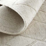 Close-up of the hand-woven Feizy Redford Ivory/Gray Area Rug showing wool texture and subtle geometric pattern. Fold