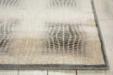 Close-up of the Nourison Utopia Shell rug showing its shell color, geometric pattern, and soft texture.