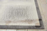 Close up of the Nourison Utopia Shell rug, showcasing its shell color and mid-century modern grid pattern.