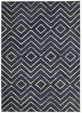 Close-up of the Barclay Butera Intermix Storm rug. Navy wool rug with a geometric diamond and chevron pattern.