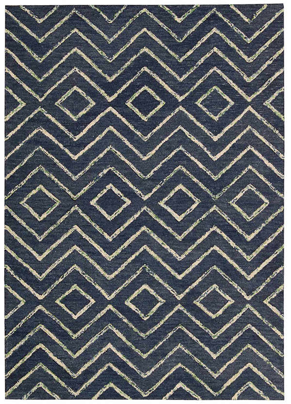 Close-up of the Barclay Butera Intermix Storm rug. Navy wool rug with a geometric diamond and chevron pattern.