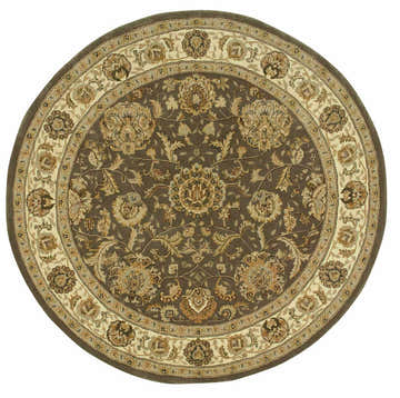 Close-up of a round Nourison 2000 Slate Persian rug. Taupe, cream, and brown floral pattern. Handmade wool rug.