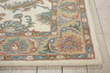 Close-up of the Nourison India House Ivory/Gold Persian rug, showcasing its wool texture and floral pattern in ivory, gold, pink, and blue.