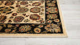 Close-up of the Nourison Delano Ivory Black rug showing floral pattern, black border, and ivory, chestnut, and red colors.