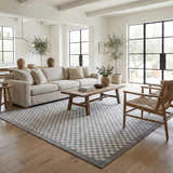 Living room with a light gray sofa and Gaiwan Cream Gray Washable Area Rug with a subtle checkerboard pattern. Roomscene-Rectangle