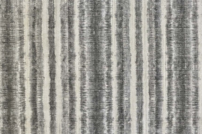Close-up of Feizy Mackay rug featuring a gray, ivory, and black striped transitional design. Hand-woven wool and viscose texture. Texture
