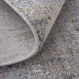 Close-up of Feizy Lennon Taupe/Tan/Blue Area Rug showing abstract pattern and soft, textured pile. Fold