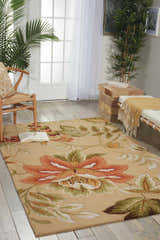 Sunlit room with a Nourison Fantasy Beige rug featuring large floral patterns, a chair, and bench.
