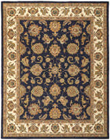 Close-up of Feizy Wagner Traditional Oriental rug. Hand-tufted wool rug in blue, tan, and gold floral pattern with a cream border. Design-Rectangle