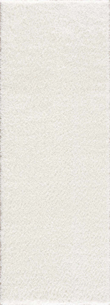 Close-up of the Crevalo Cream rug. Subtle wavy texture in a minimalist design. Soft, shag pile. Design-Runner