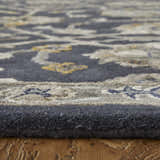 Close-up of Feizy Prescott rug showing blue, silver, and gray floral pattern and hand-tufted texture. Pile