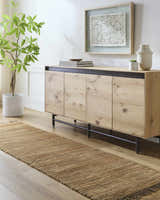 Entryway scene with a camel Mihal Jute Rug runner, light wood console table, and potted plant for a natural, farmhouse style. Roomscene-Runner