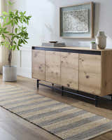 Entryway with camel and natural jute striped Ilkay Jute Area Rug runner, wood console table, and potted plant. Roomscene-Runner