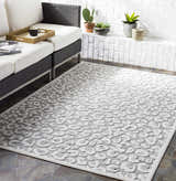 Modern patio with white sofa and Seascale Outdoor Carpet. Gray animal print rug on stone tile floor. Roomscene-Rectangle
