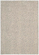 Close-up of the Nourison Nepal Quartz Vintage rug. Features a light beige, abstract pattern on a quartz-colored wool texture.