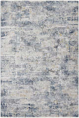 Close-up of the Hyman Area Rug: a contemporary rug in camel, denim, and gray with a distressed, abstract pattern. Design-Rectangle-575