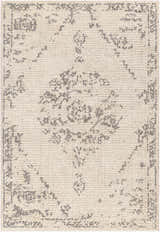 Close-up of the Tait Area Rug. Bone rug with a traditional dark gray pattern. Machine woven polyester rug. Design-Rectangle-537