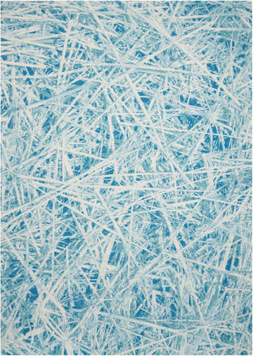 Close-up of Nourison Home & Garden Marine Modern Area Rug. Blue rug with white abstract pattern.