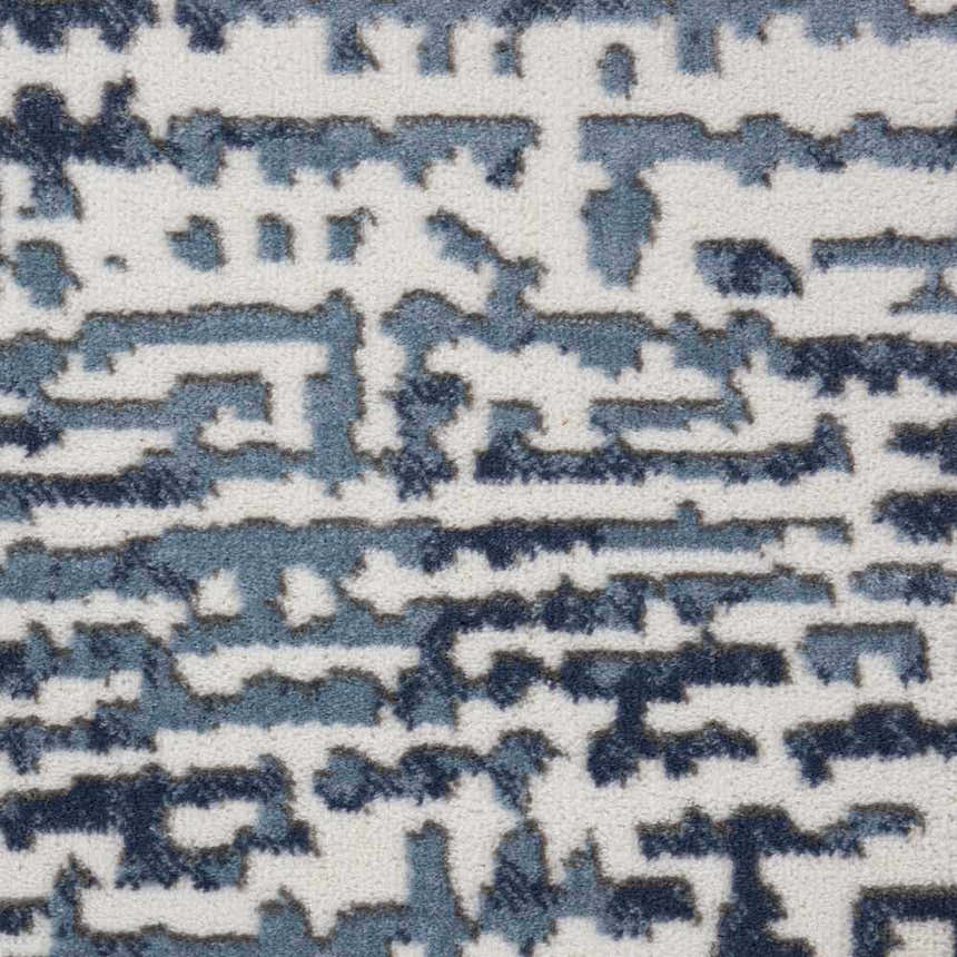 Close-up of the Nourison Urban Decor Slate/Ivory rug showing its abstract, modern pattern and soft, textured pile.
