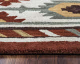 Close up of the hand-tufted Rizzy SU1822 area rug. Southwestern style with navy, off white, red, sage, and tan colors. Pile