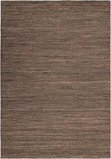 Close-up of Calvin Klein Monsoon Cinnamon rug. Handmade jute and wool felt rug with a horizontal striped texture in dusty coral hues.