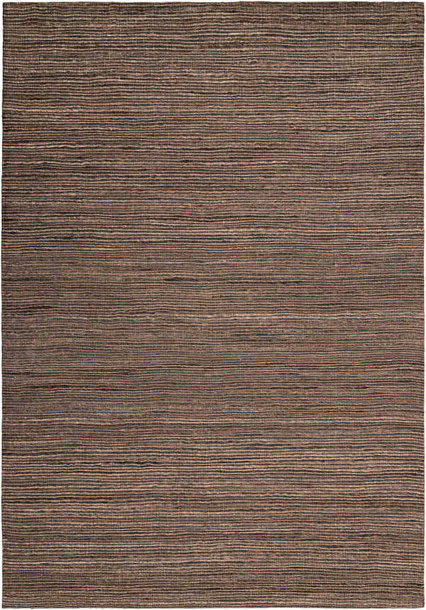 Close-up of Calvin Klein Monsoon Cinnamon rug. Handmade jute and wool felt rug with a horizontal striped texture in dusty coral hues.
