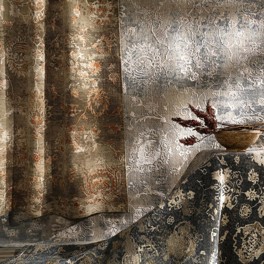 Close-up of the Limay Premium Wool Rug. Features brick red, beige, and olive tones with a traditional floral pattern. Styleshot