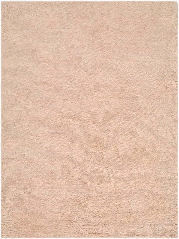 Close-up of the hand woven Kanuha Washable Area Rug. Plush, blush pink wool rug with a subtle texture. Design-Rectangle