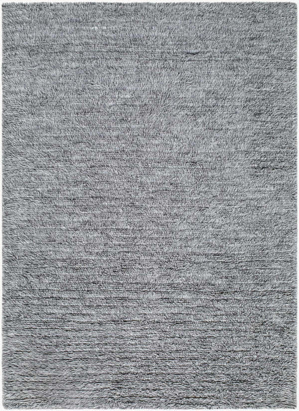 Close-up of the Kanuha Washable Area Rug, hand woven in shades of charcoal, silver gray, and steel gray wool. Contemporary style. Design-Rectangle