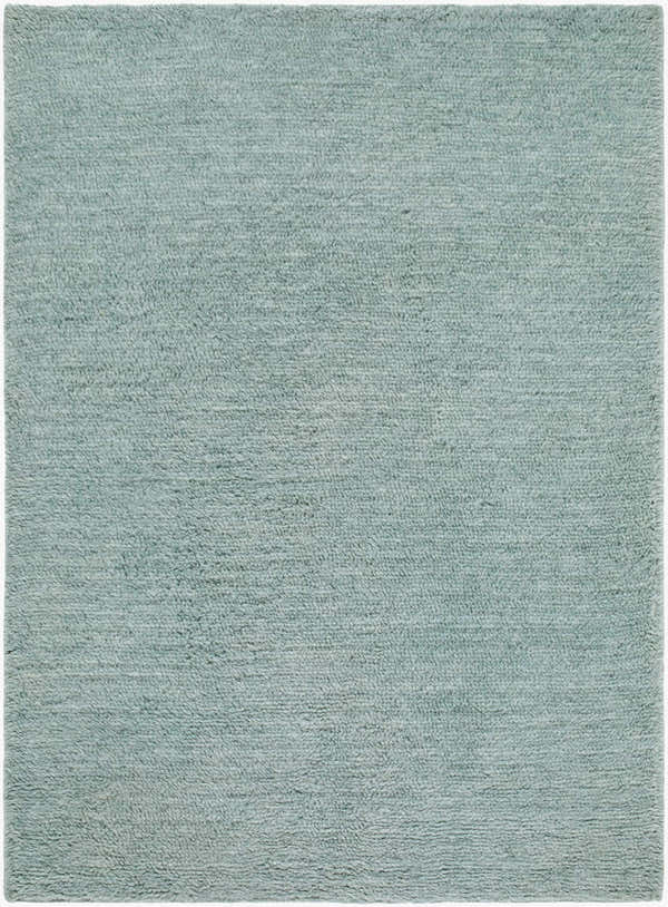 Close-up of the hand woven Kanuha Washable Area Rug. Sage green wool rug with a subtle, contemporary texture. Design-Rectangle